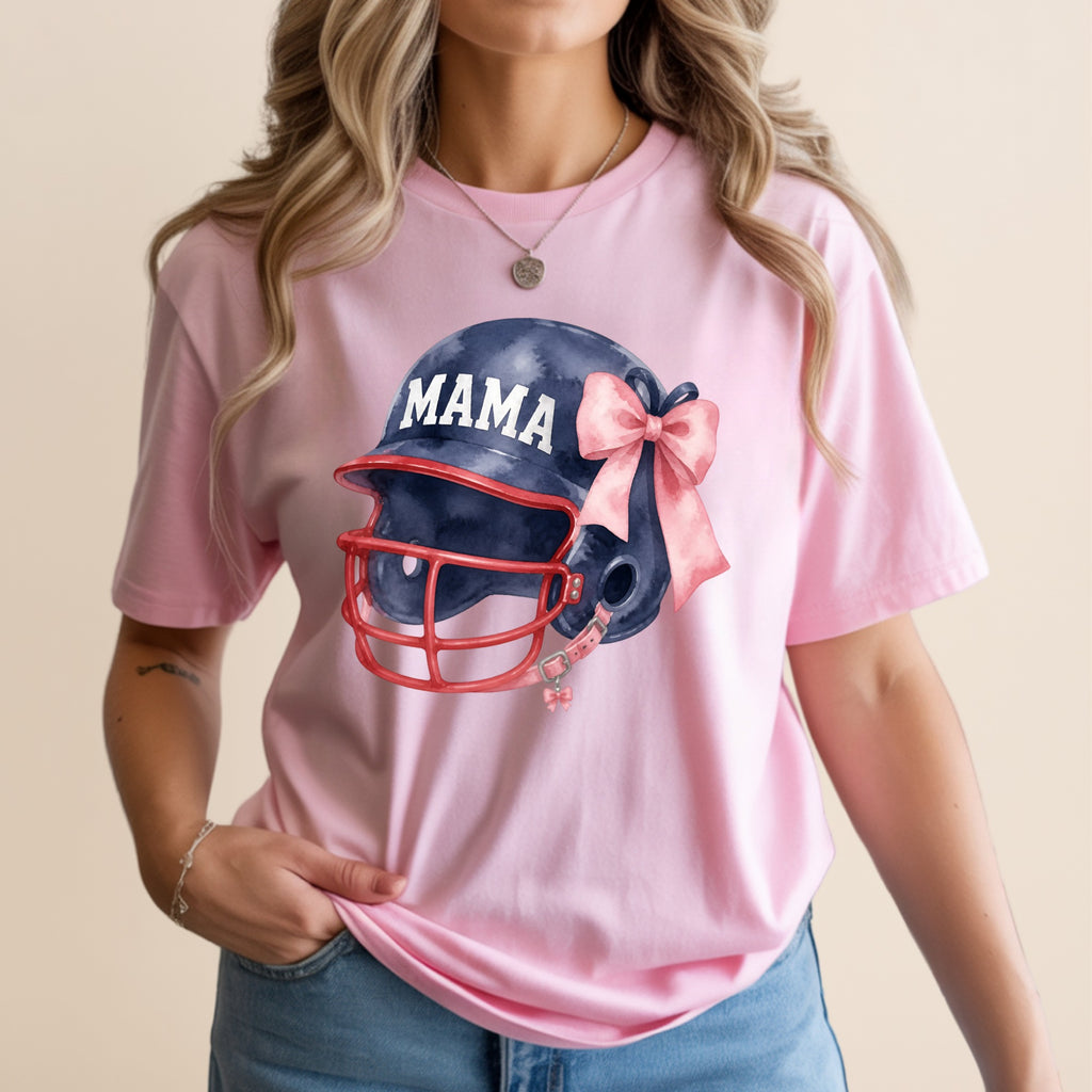 Pink t-shirt with a navy blue football helmet and pink bow graphic.