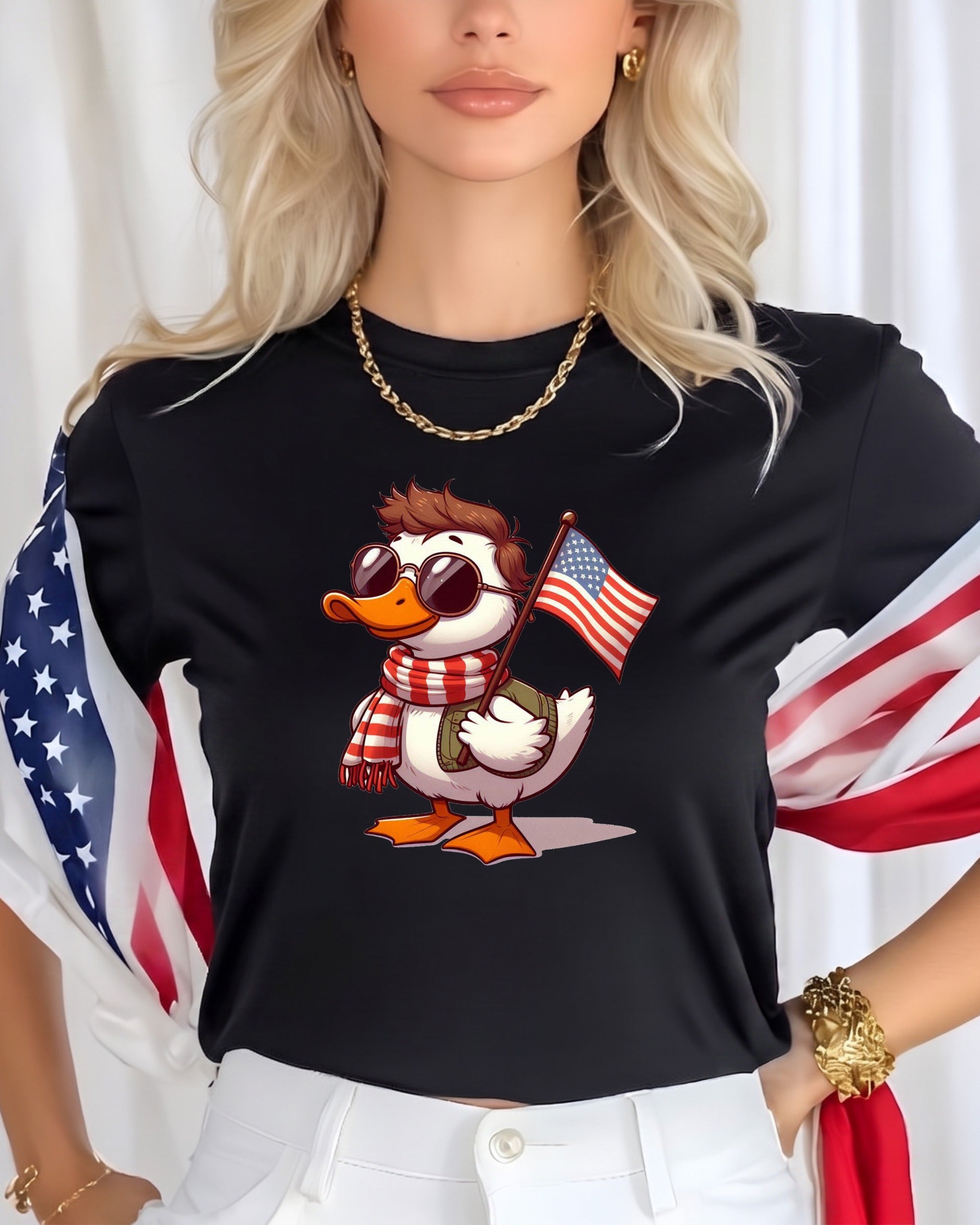 Cartoon duck in sunglasses and scarf holding American flag on black t-shirt.