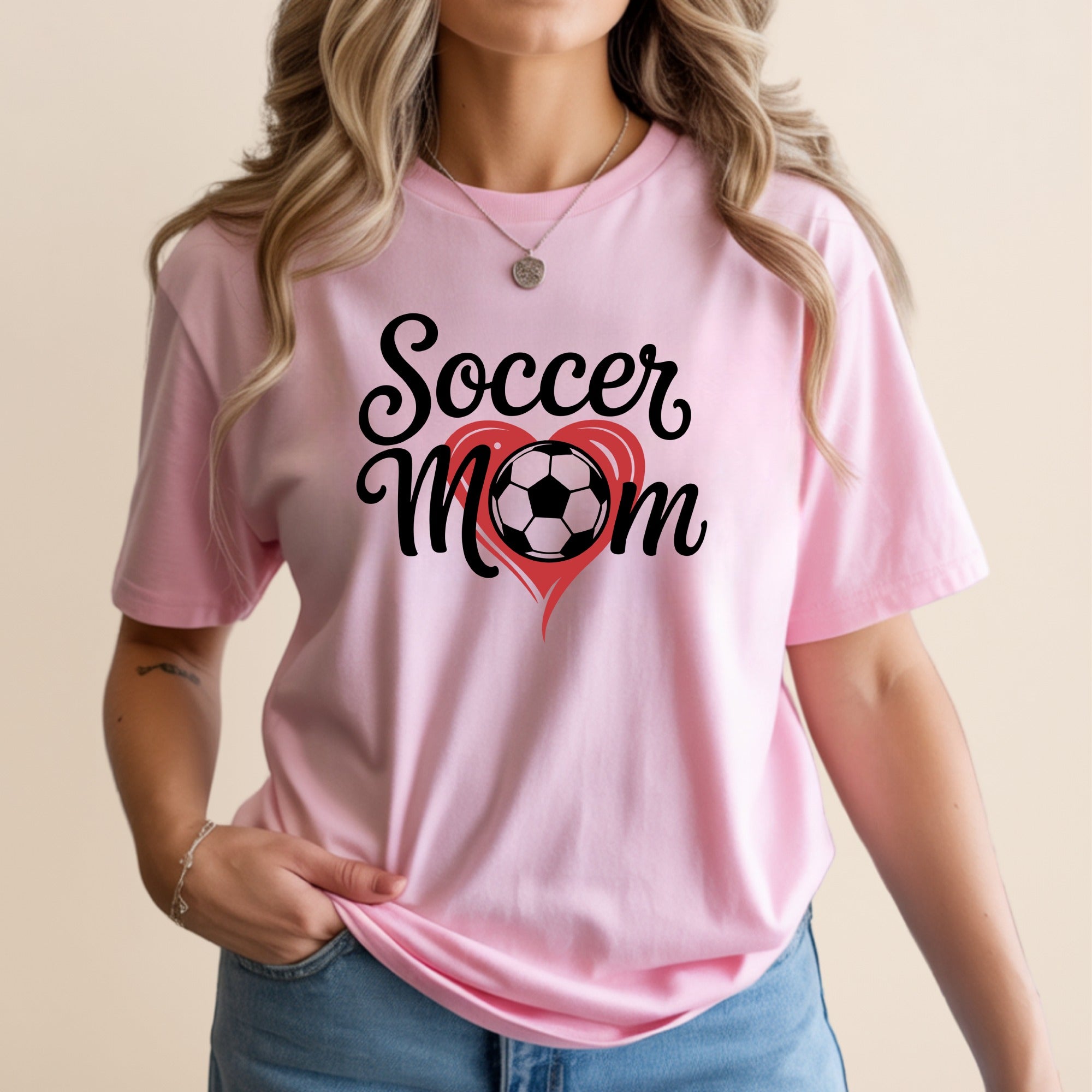 Pink t-shirt with "Soccer Mom" text and a red heart with a soccer ball.
