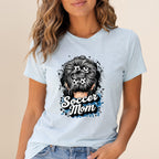 Light blue t-shirt with messy bun hairstyle featuring soccer balls and "Soccer Mom" text.
