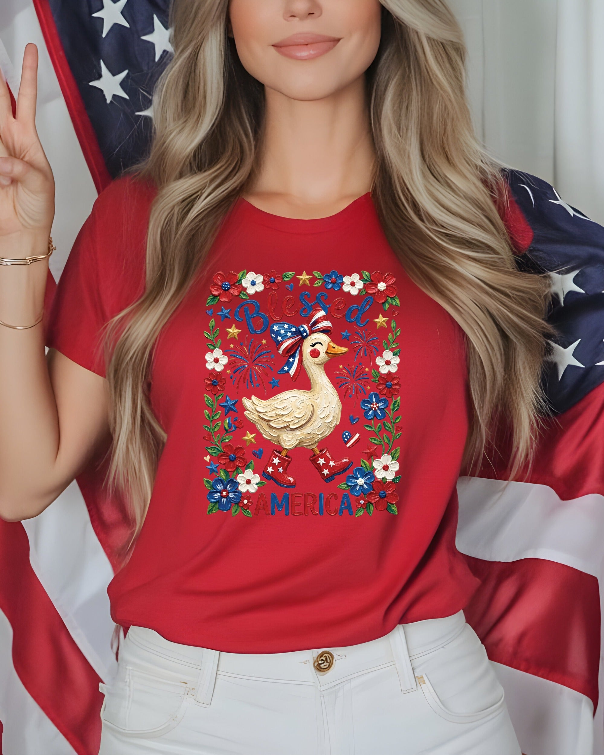 Woman wearing red shirt with patriotic duck graphic and US flag.