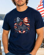 Navy t-shirt with patriotic Fourth of July bow design and fireworks.