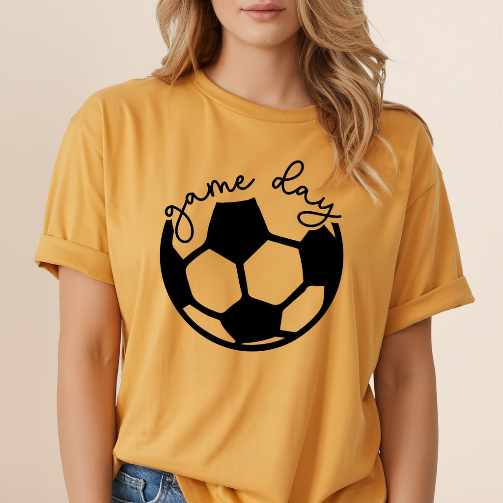 Yellow t-shirt with "game day" text above a black soccer ball graphic.