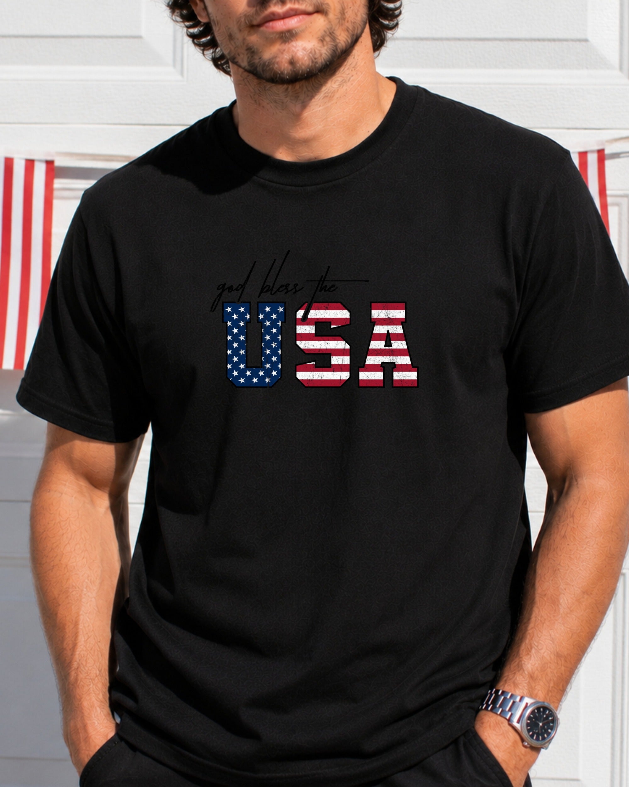 Black t-shirt with "God Bless the USA" in American flag lettering.