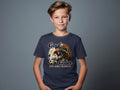 Boy in navy t-shirt with soccer player kicking ball and text "Goal Getter".