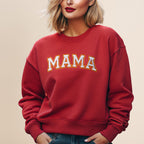 Red sweatshirt with "MAMA" embroidered across the chest.