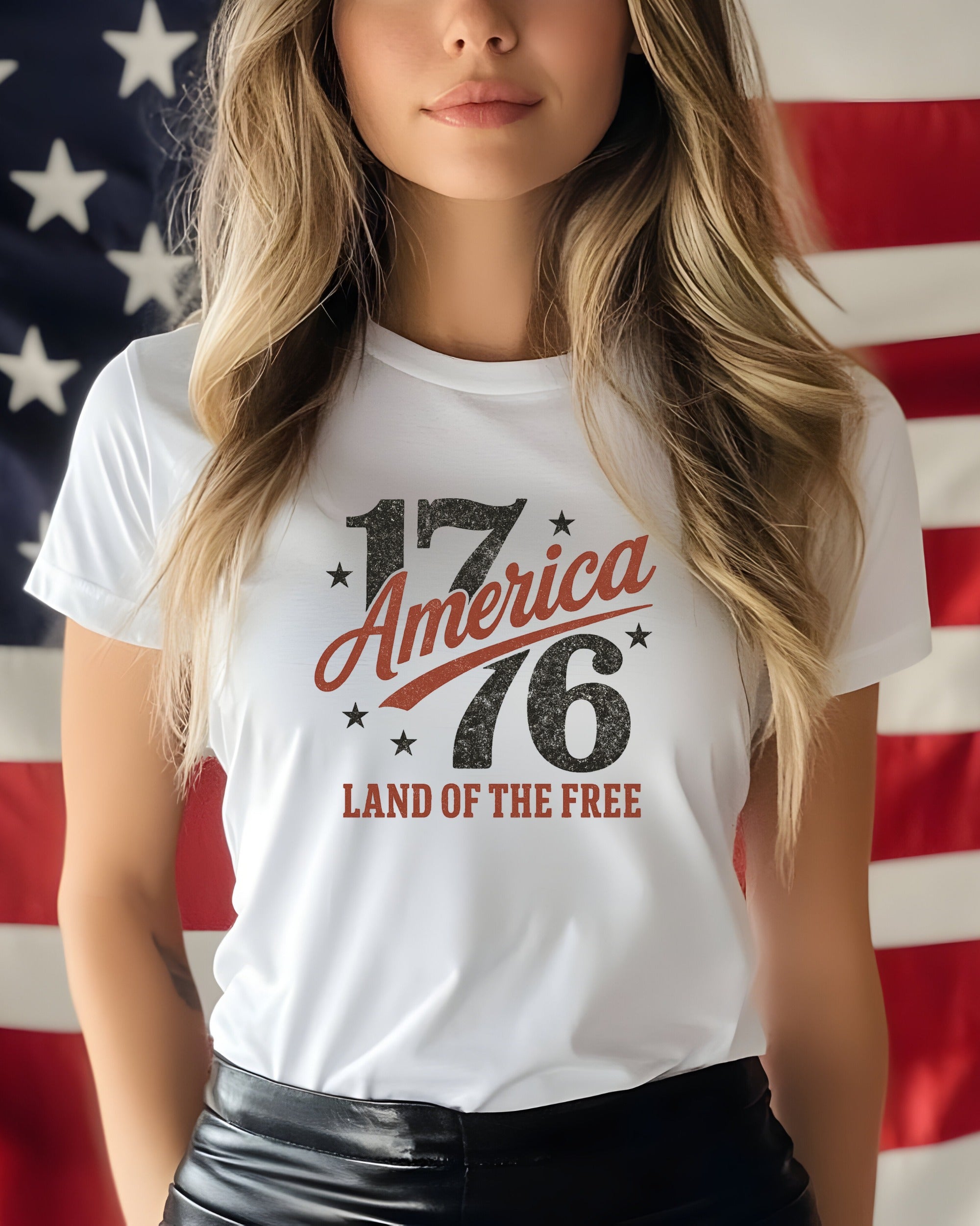 White t-shirt with "1776 America Land of the Free" graphic.