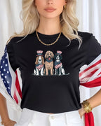 Three dogs wearing patriotic hats and bandanas on a black t-shirt.
