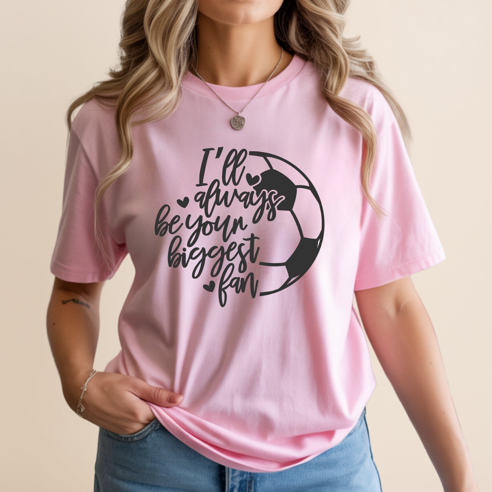 Pink t-shirt with "I'll always be your biggest fan" and a soccer ball graphic.