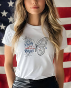 White t-shirt with patriotic butterfly design and "Land of Liberty Home of the Brave" text.