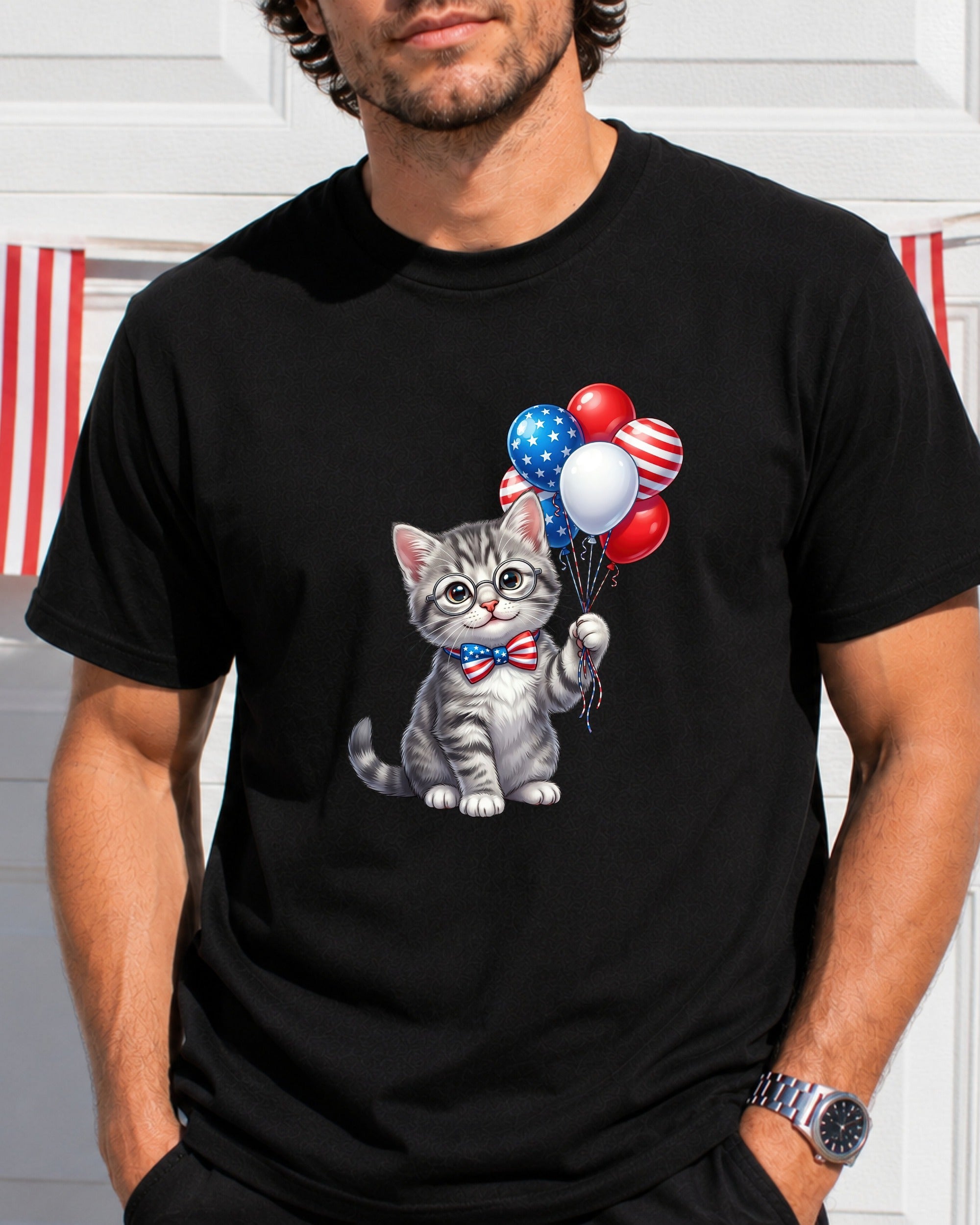 Gray kitten with patriotic balloons and bow tie on a black t-shirt.