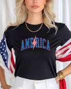 Black t-shirt with "AMERICA" in red, white, and blue lightning bolt letters.
