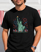 Statue of Liberty with fireworks and flowers, on a black t-shirt.