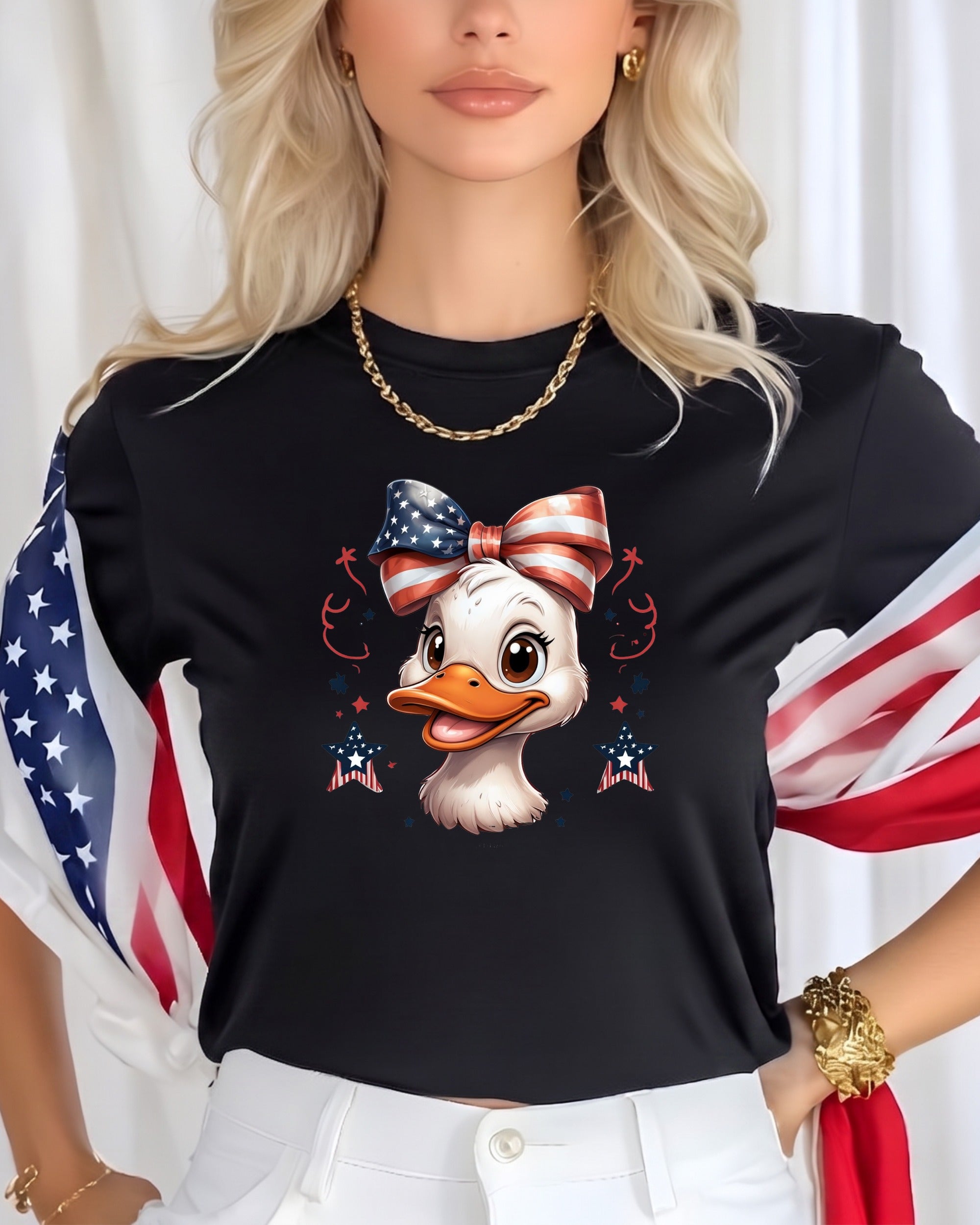Black t-shirt with a cartoon duck wearing a patriotic bow, front view.