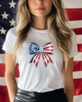 White t-shirt with red, white, and blue star-spangled bow graphic.