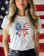 White t-shirt with red, white, and blue star-spangled bow graphic.