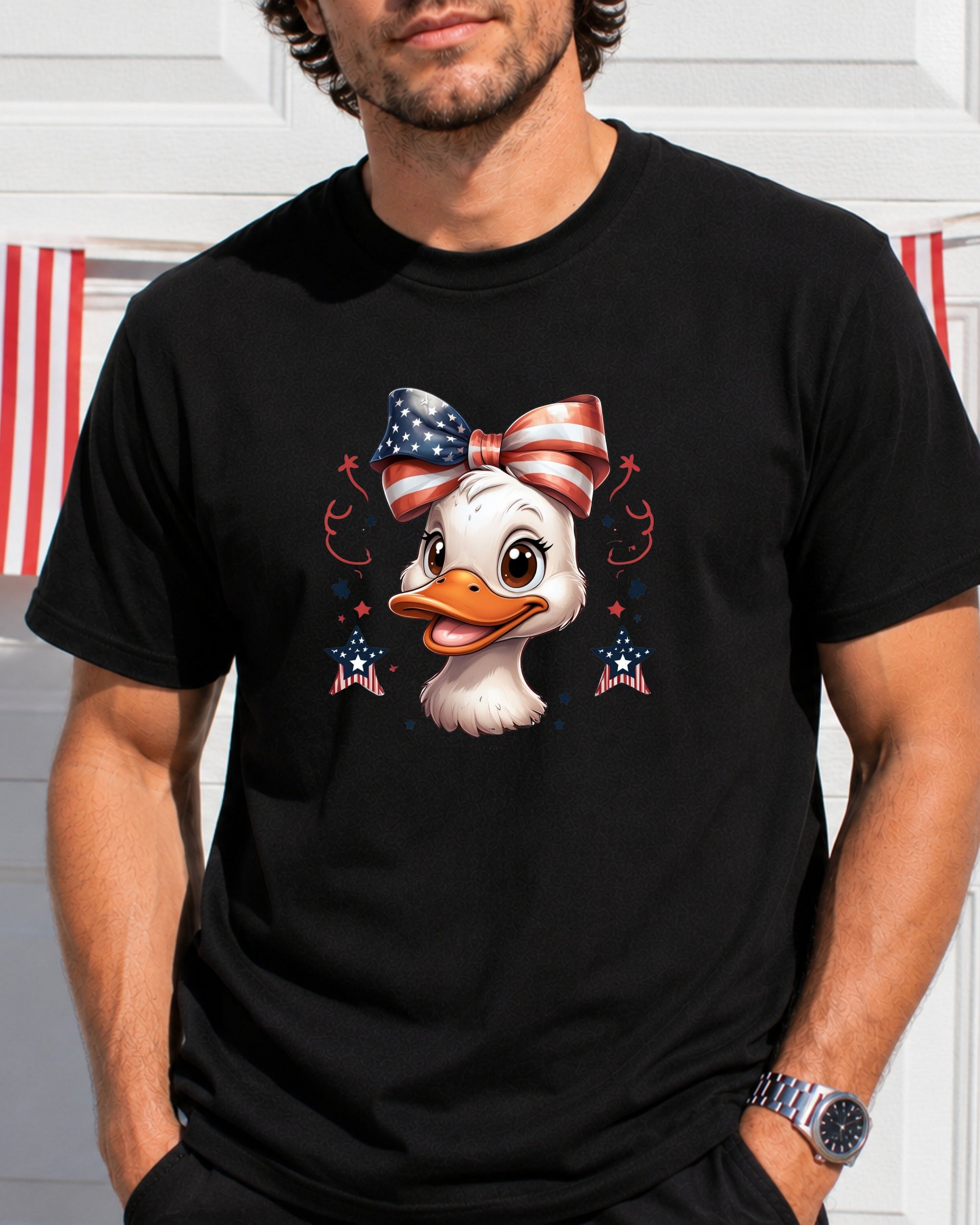 Duck wearing a patriotic bow, stars, and stripes design on a black t-shirt.