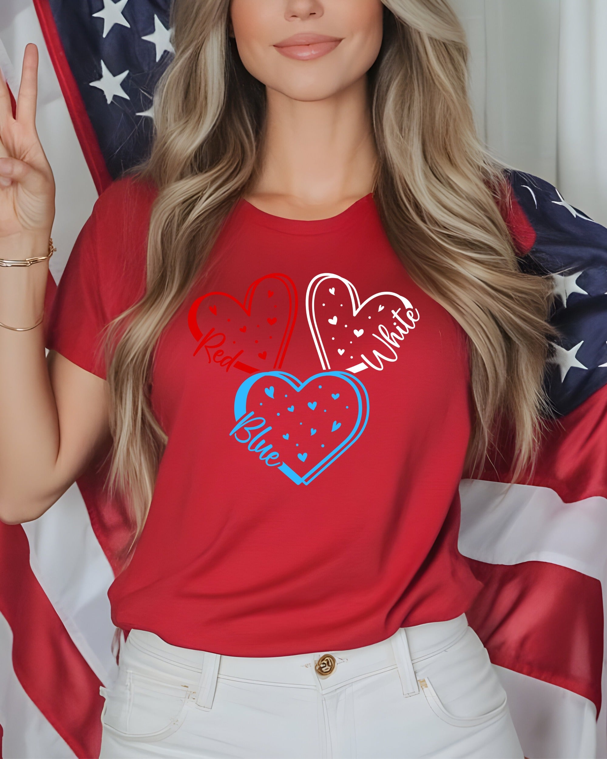 Woman in red t-shirt with red, white, and blue heart graphic and American flag.