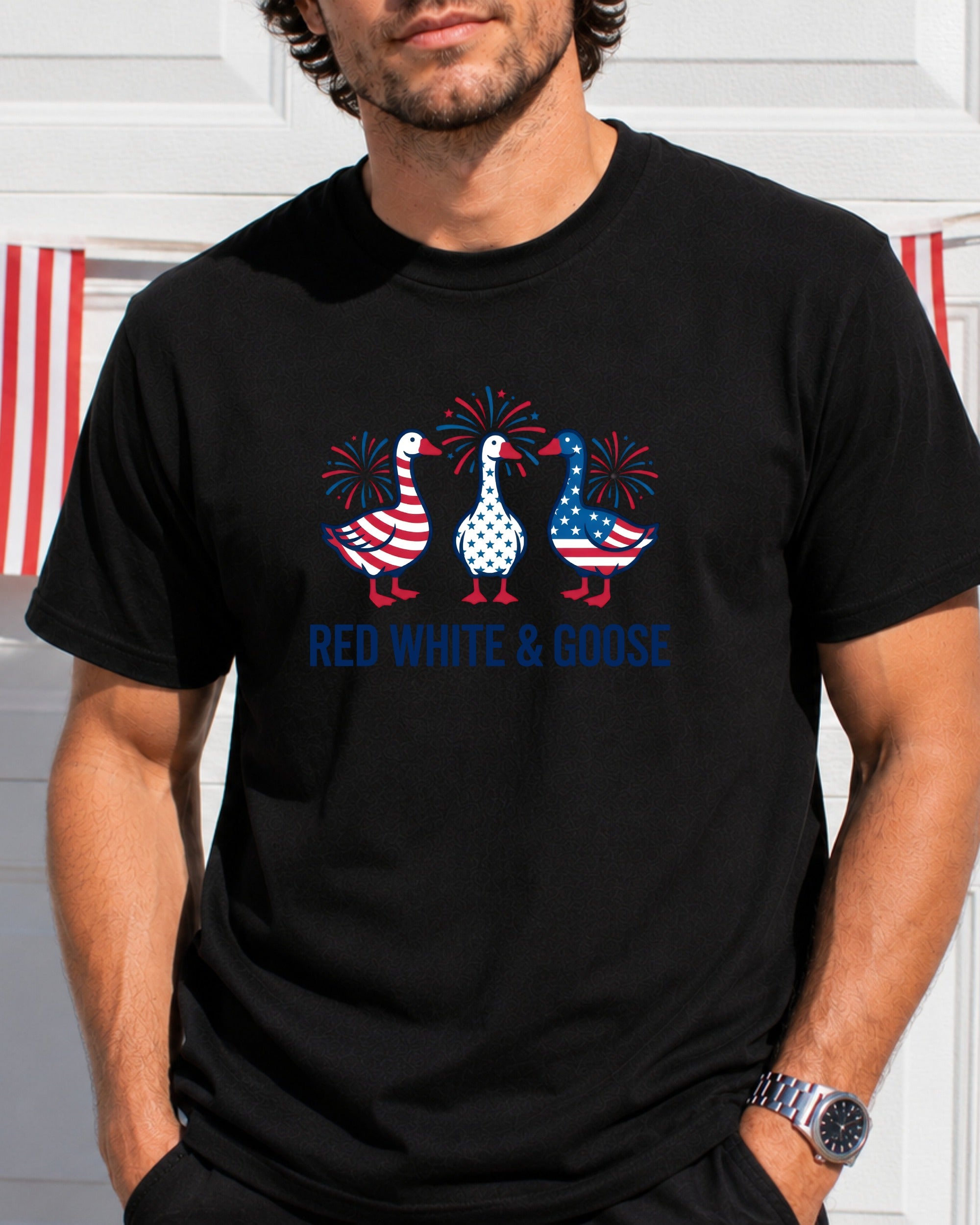 Black t-shirt with red, white, and blue geese and fireworks graphic.
