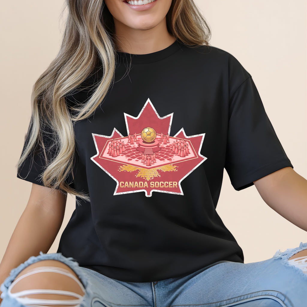 Black t-shirt featuring a maple leaf with Canada Soccer text and a golden soccer ball.