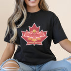 Black t-shirt featuring a maple leaf with Canada Soccer text and a golden soccer ball.