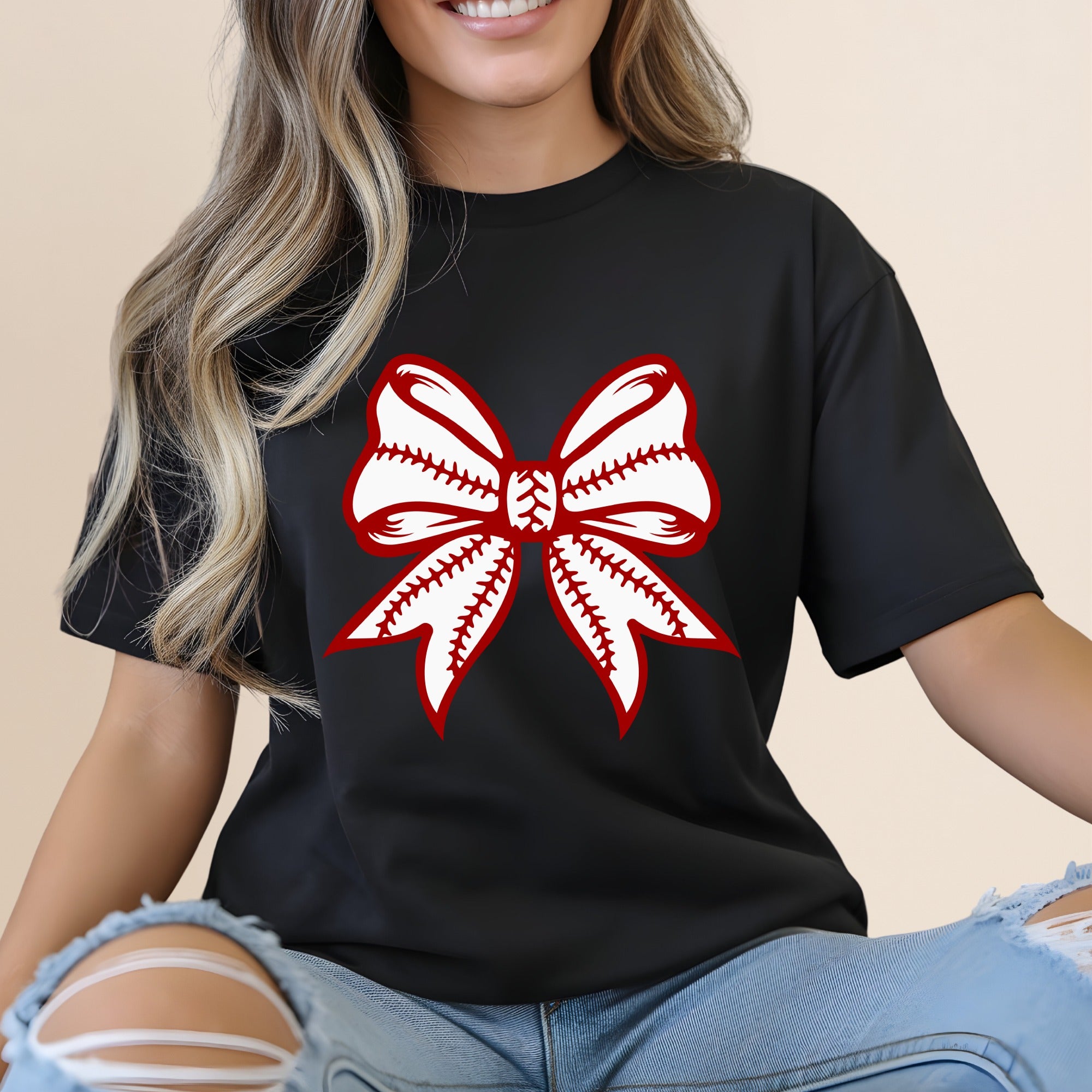 Black t-shirt with a red and white baseball bow graphic.