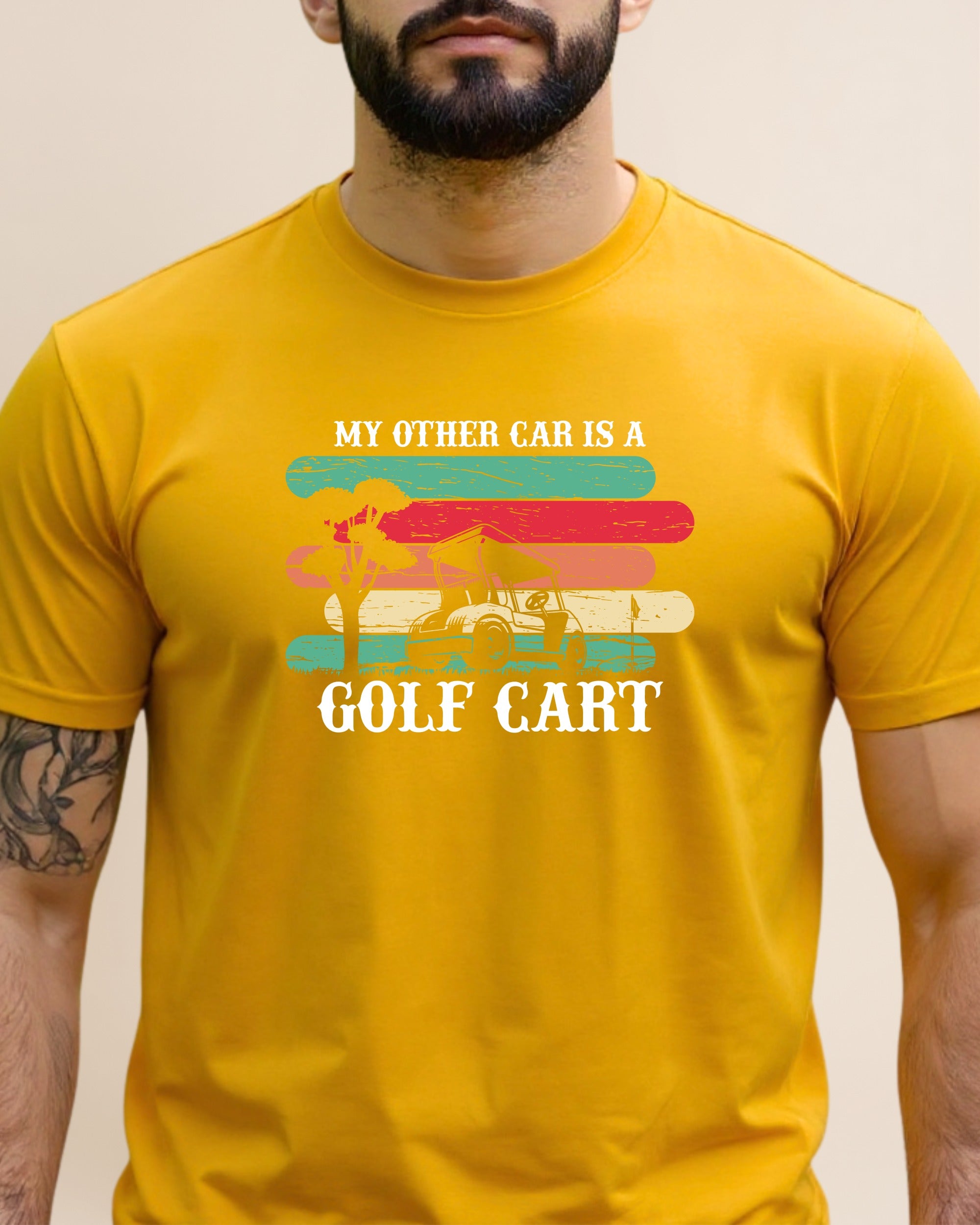 Yellow t-shirt with text "My other car is a golf cart" and graphic.