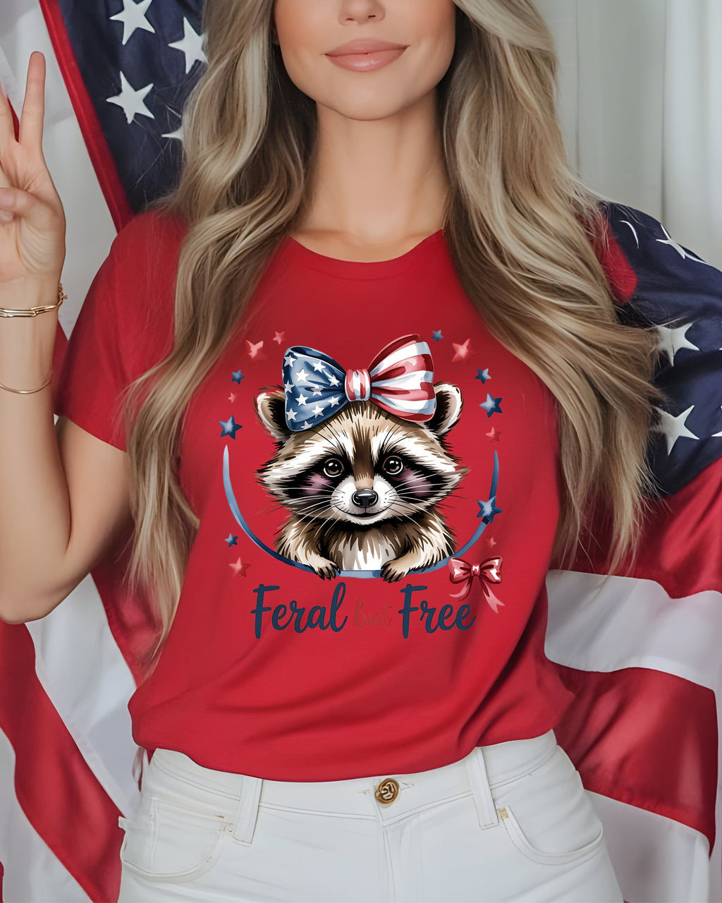 Red t-shirt with raccoon graphic and "Feral but free" text.