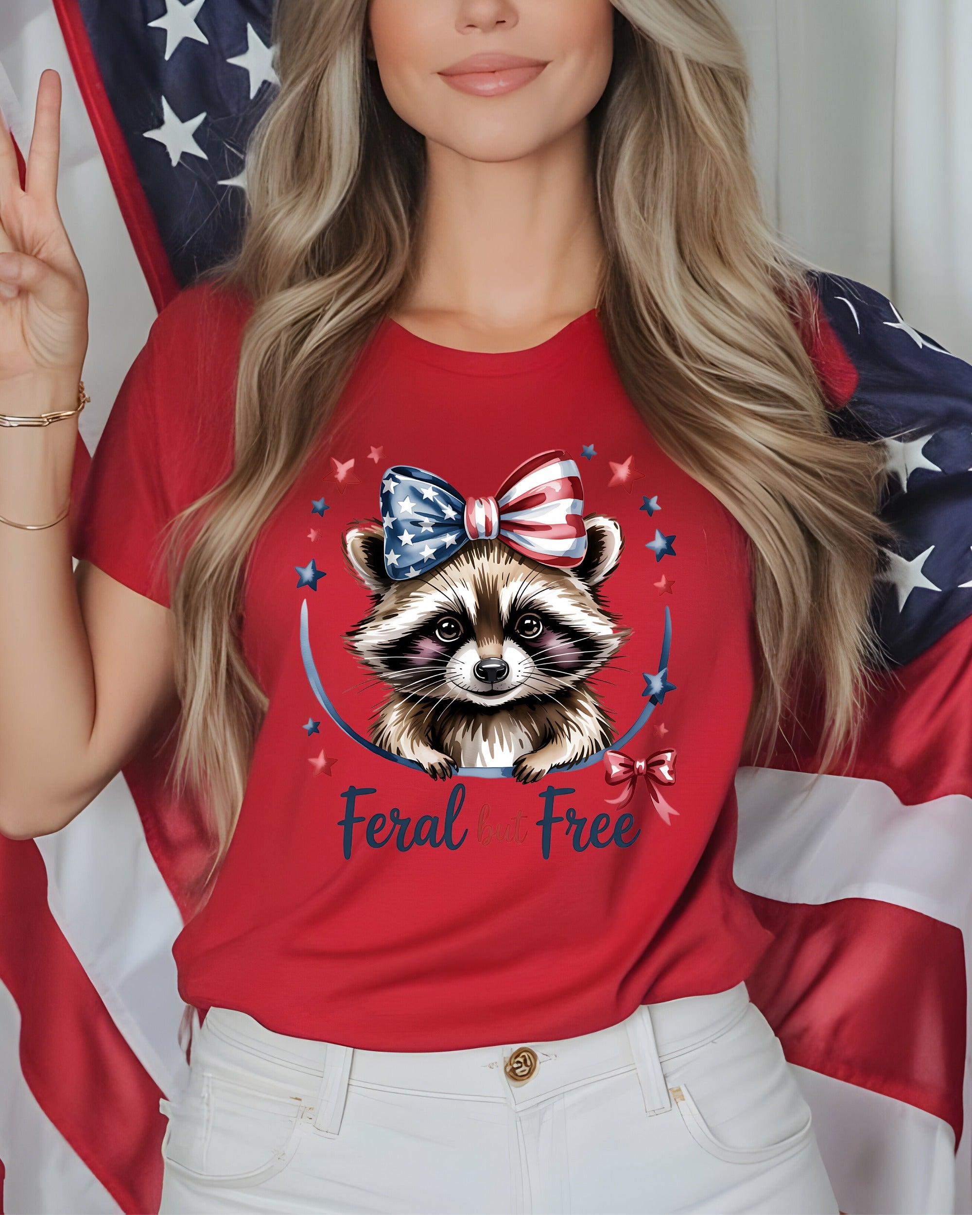 Red t-shirt with raccoon graphic and "Feral but free" text.