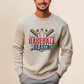 Cream sweatshirt with "Baseball Season" graphic and crossed bats.