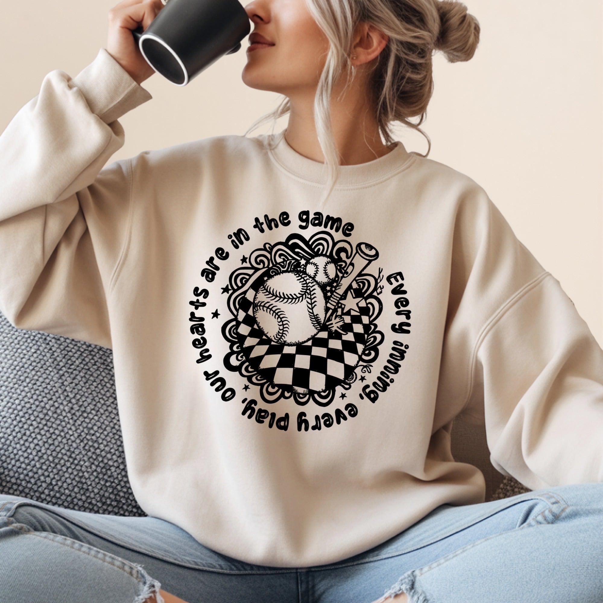 Crewneck sweatshirt with baseball graphic and inspirational text.