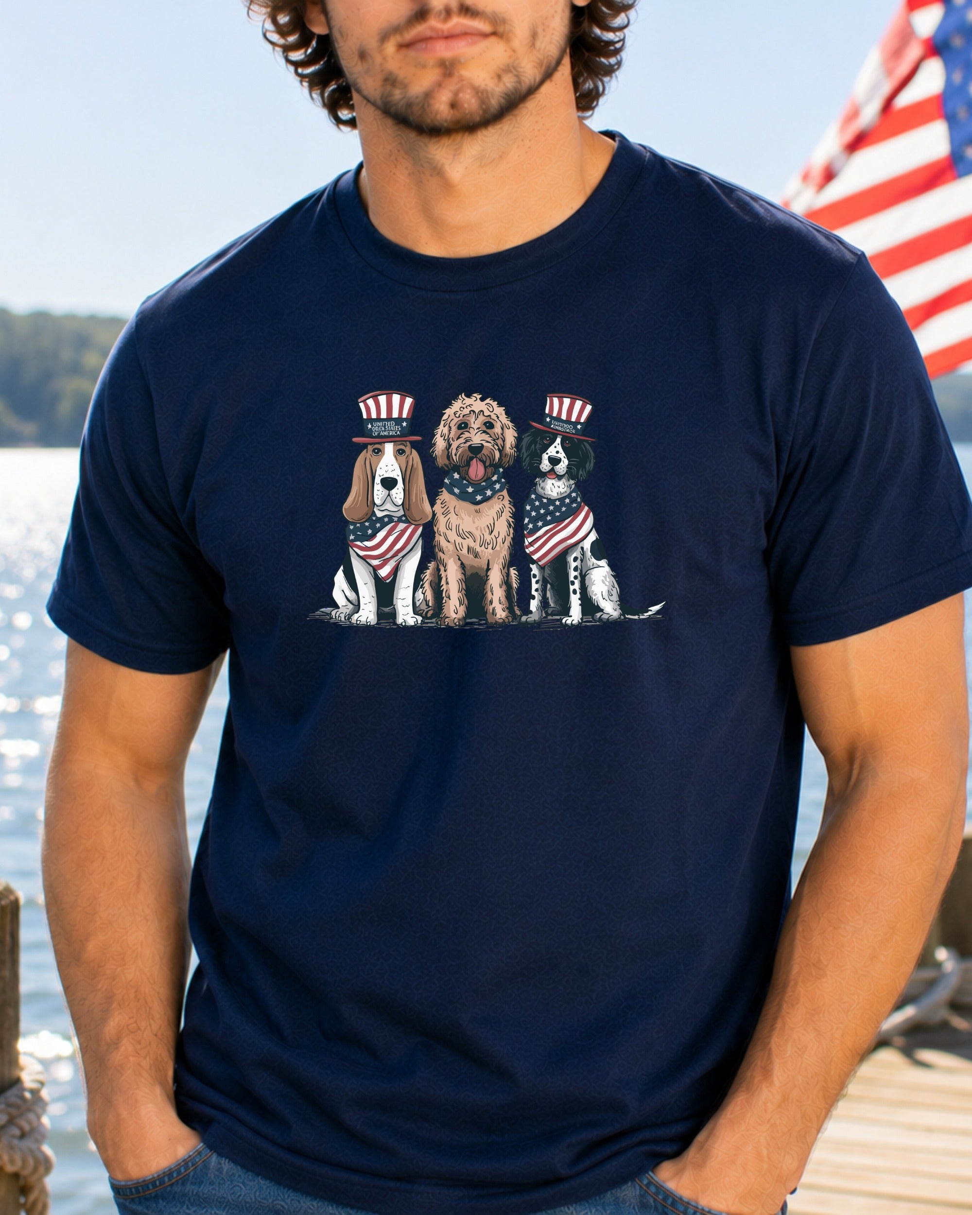 Three dogs in patriotic hats and bandanas sit together.