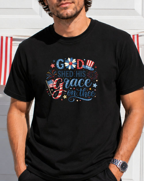 T-shirt with "God Shed His Grace On Thee" text, flag, and patriotic symbols.