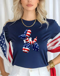Dog-shaped balloon with American flag pattern on a navy blue t-shirt.