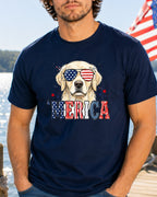 Golden retriever wearing sunglasses with "Merica" text on t-shirt.