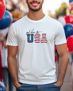 White t-shirt with "God Bless the USA" text in US flag design.