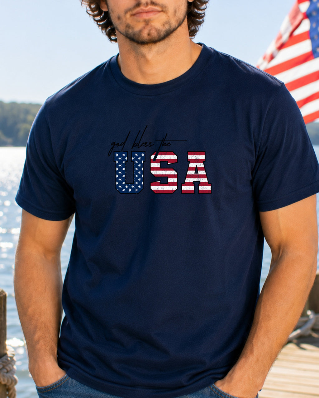 Navy t-shirt with "God Bless the USA" text in American flag design.