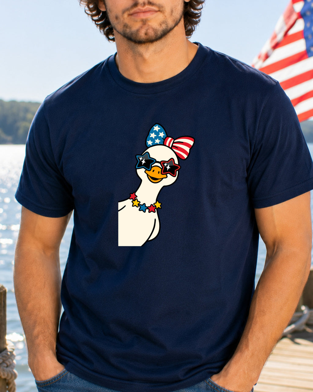 Cartoon goose wearing sunglasses, bow tie, and necklace on a navy t-shirt.