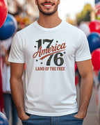 White t-shirt with "1776 America Land of the Free" text.