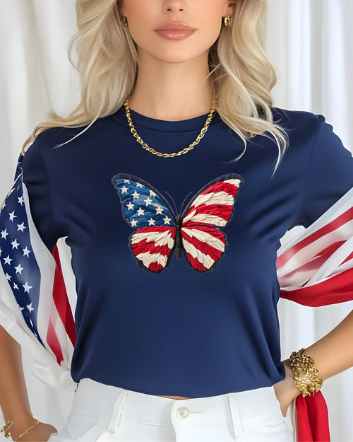 Navy t-shirt with American flag butterfly graphic and flag draped over shoulders.