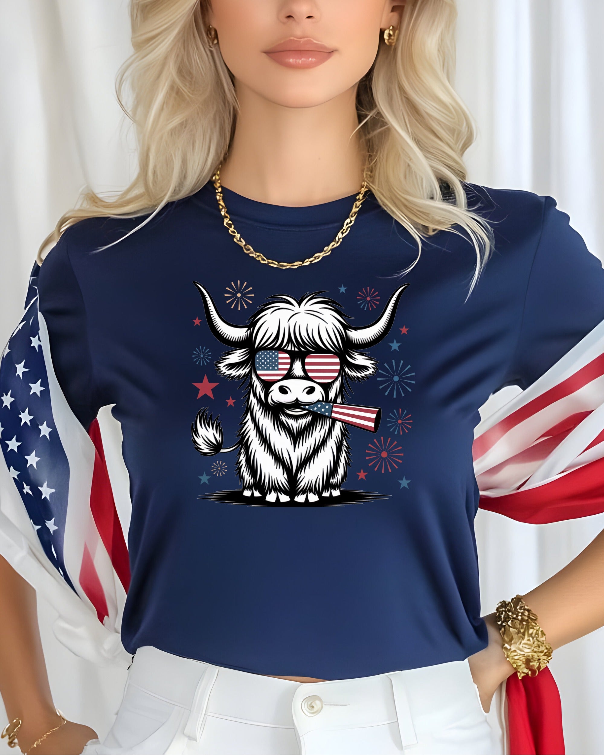 Highland cow wearing sunglasses holding American flag, on navy t-shirt.