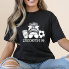 Black t-shirt with graphic of coffee cup, soccer ball, and text "SOCCERMOMLIFE".