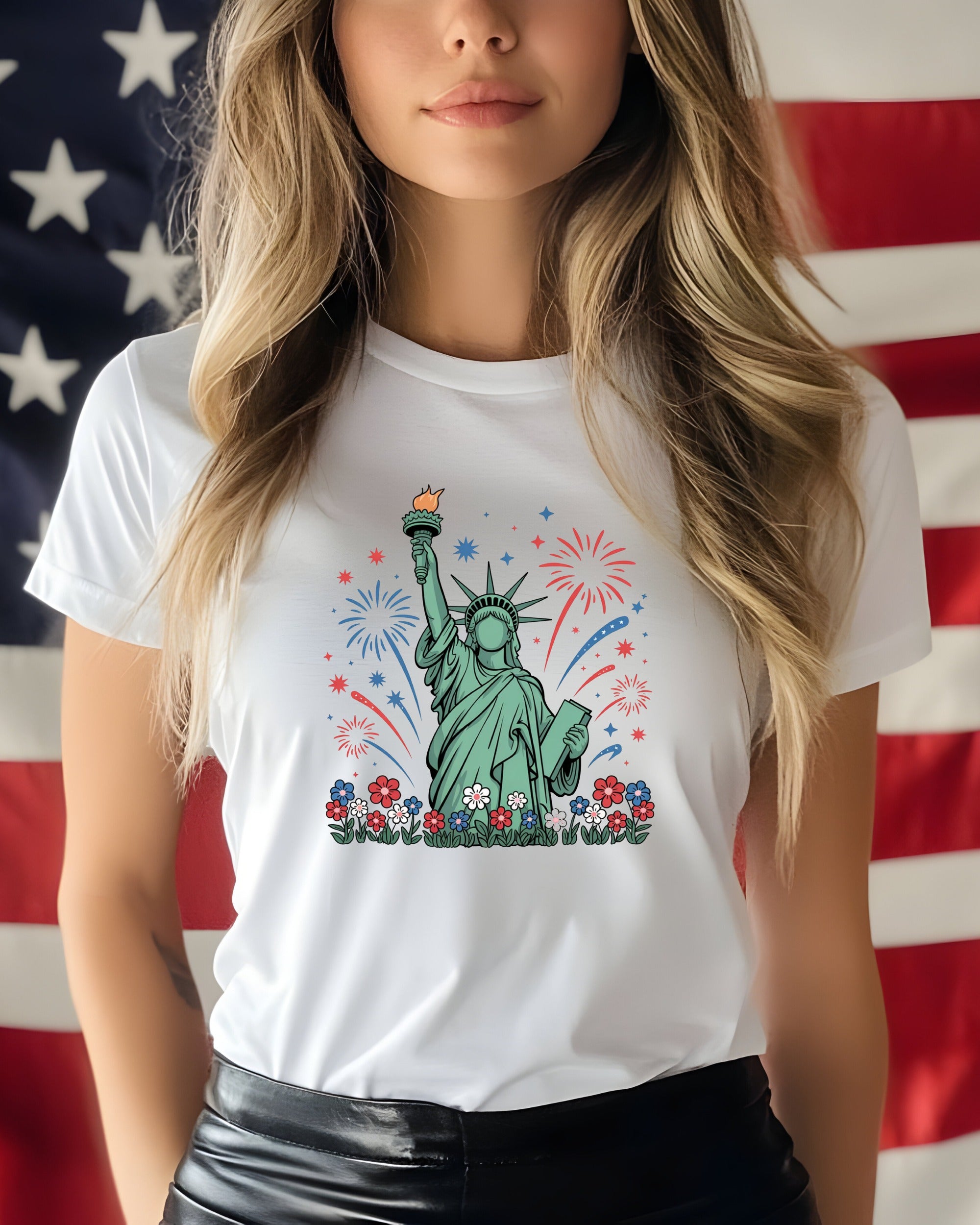 White t-shirt with Statue of Liberty and fireworks design.