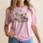 Pink t-shirt with "Soccer Moms Club" text and soccer-themed graphics.
