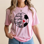 Pink t-shirt with a graphic of a soccer ball and "I'll always be your biggest fan" text.