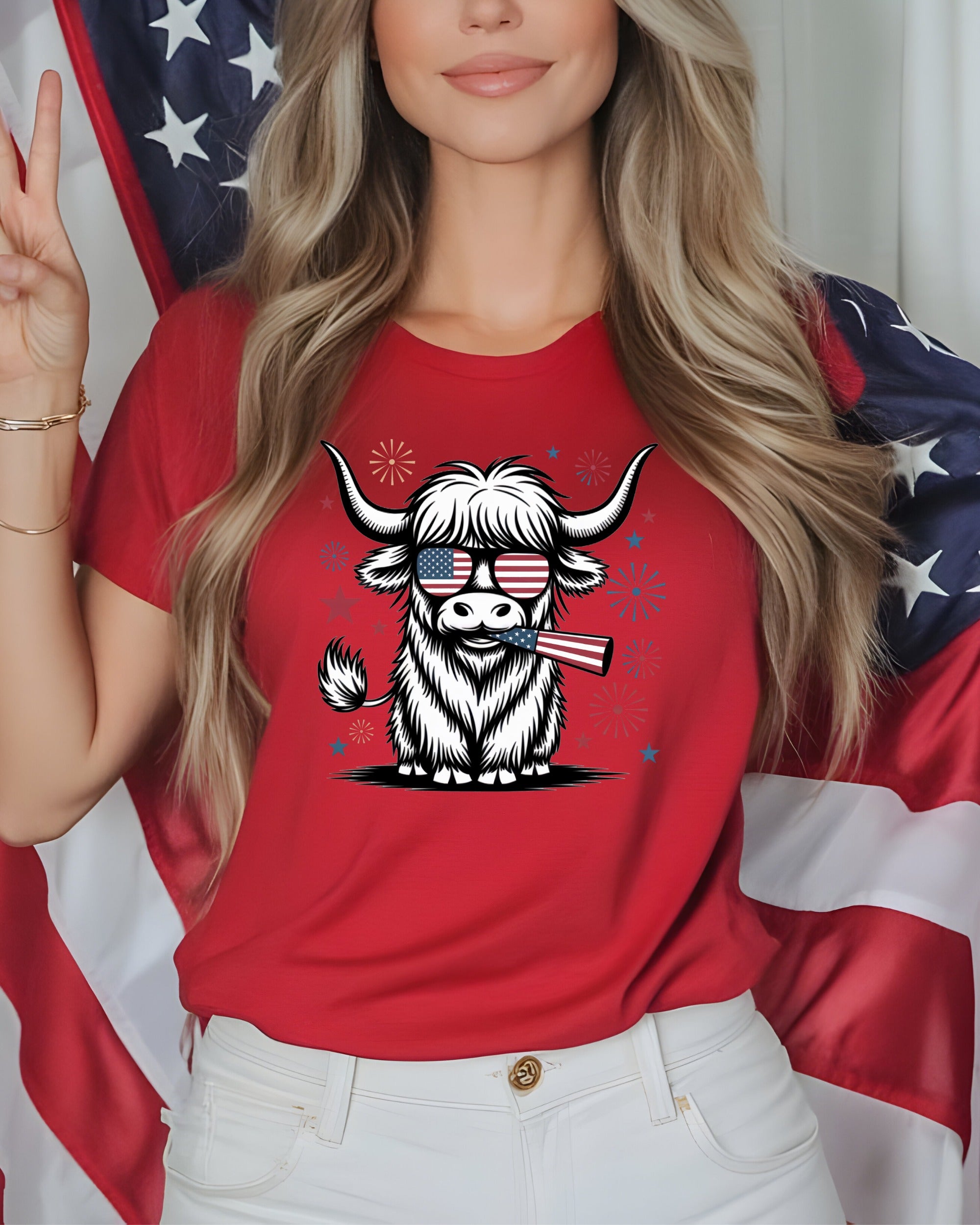 Woman in red shirt holding American flag, wearing patriotic cow graphic t-shirt.