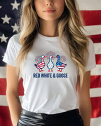 White t-shirt with red, white, and blue geese graphic and text.