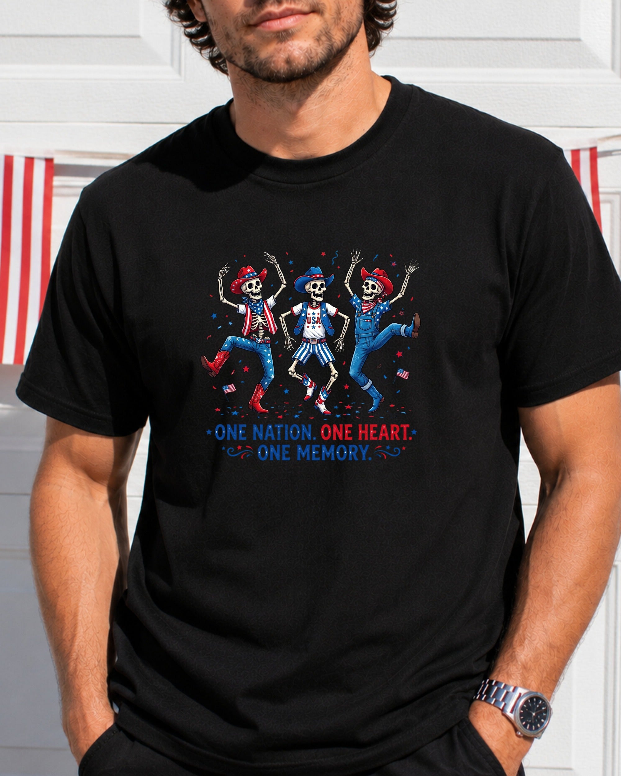 T-shirt with dancing skeletons in patriotic outfits and "One Nation, One Heart, One Memory."